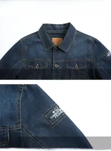 Close-up of denim jacket collar with leather label and sleeve embroidery detail