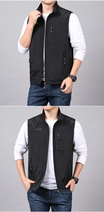 Detail view of black outdoor multi-pocket fishing vest with secure zipper pockets
