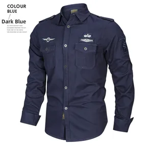 Detail of navy blue long sleeve military shirt with embroidered patches and chest pockets