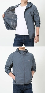 Detail of grey men's hooded sun protection jacket with zip pockets and logo prints