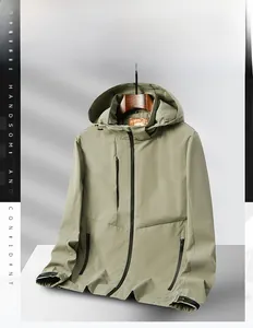 Detail of men's hiking jacket showing waterproof zippers and adjustable hood in khaki