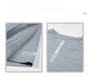 Detail of grey quick-dry T-shirt featuring reflective silver strips on cuffs and back