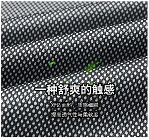 Close-up of black breathable honeycomb mesh fabric lining of a men outdoor jacket