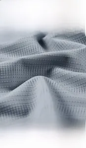 Close-up of breathable dark grey ice silk fabric with cooling micro-pore mesh texture