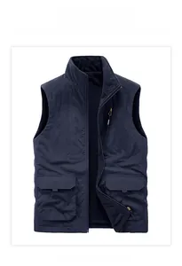Detail of blue reversible fleece gilet showing multi-pockets and soft lining texture