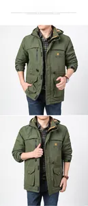 Detail showing the army green hooded cargo jacket with functional pockets and velcro cuffs