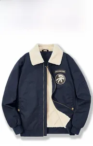 Detail of navy pilot jacket with white lamb wool collar and ARMY AIRBORNE patch