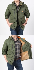Close-up of men's military green parka featuring plush lamb wool lining and rough stock print