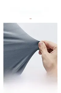 Close-up of grey breathable ice silk fabric showing high elasticity and mesh texture
