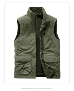 Detail of olive green windproof vest with stand collar and polar fleece lining texture
