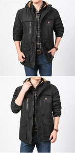 Detail of men's black tactical jacket with fleece lining and orange accents