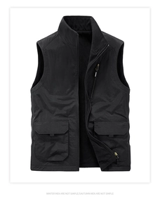Detail of windproof black gilet featuring cargo pockets and warm fleece lining