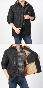 Detail view of winter outdoor hooded jacket with thick camel fleece lining and black shell