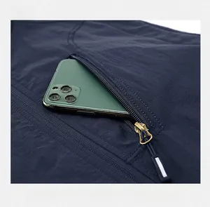 Detail view of the large zipper pocket on this blue reversible fleece vest with a smartphone