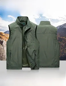 Detail of green outdoor vest featuring multiple zip pockets and breathable mesh lining