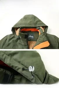 Close-up of military green padded jacket with khaki fleece lining and orange piping details