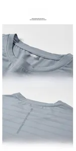 Detail of light grey quick-dry T-shirt showing round neckline and reflective back stripe