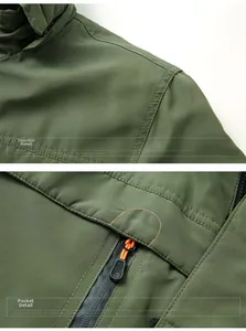 Detail view of reinforced shoulder stitching and zipper pocket on army green jacket