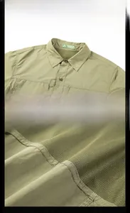 Detail of olive green tactical shirt showing breathable mesh lining and reinforced stitching