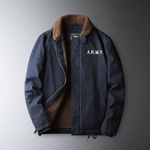 Detail of navy workwear jacket featuring thick brown sherpa fleece lining and lapel collar
