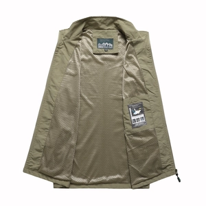Detail view of army green outdoor vest with breathable mesh lining and inner pocket