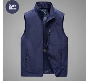 Detail of dark blue outdoor vest featuring breathable mesh lining and secure zipper pockets