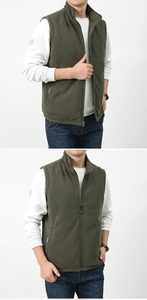 Detail of army green fleece vest showing stand collar and full zipper closure for men