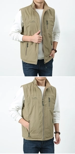 Detailed view of khaki outdoor vest with stand collar, zipper pockets, and chest embroidery