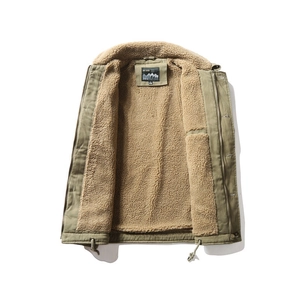 Detail view of olive green outdoor vest featuring warm lamb wool lining and drawstring hem