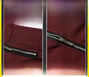 Detail of premium metal zipper and decorative pocket on dark red baseball jacket fabric