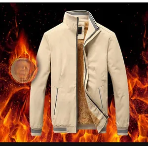 Detail view of khaki washed cotton jacket with thick warm fleece lining and ribbed cuffs