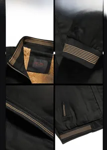 Detail view of black winter jacket showing warm fleece lining and sturdy metal zipper trim
