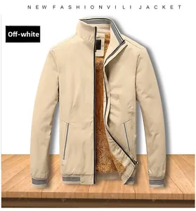 Detail view of beige washed jacket showing warm brown sherpa fleece lining and ribbed collar