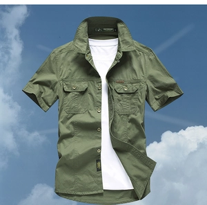 Detail of army green cotton cargo shirt with dual flap pockets and outdoor woven label