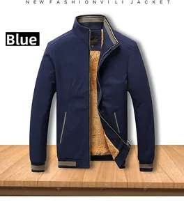 Detail of navy blue stand collar jacket with warm khaki faux fleece lining and striped cuffs
