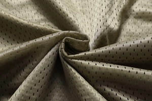 Detailed close-up of breathable olive green mesh fabric showing the airy texture