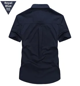 Detail of navy blue short sleeve shirt back featuring a central box pleat and neat stitching