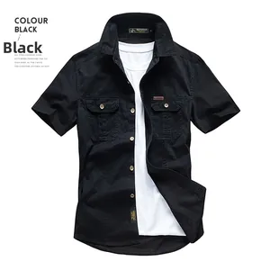 Close-up of black short sleeve work shirt featuring double chest pockets and lapel collar