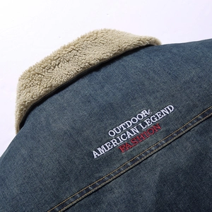 Men's navy blue denim sherpa jacket with outdoor embroidery and fleece lining details