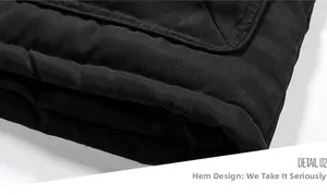 Detailansicht des schwarzen gesteppten Jackensaums mit präziser Naht und warmer Textur