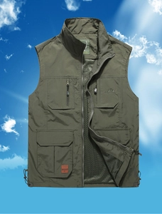 Detail of army green outdoor vest showing multiple cargo pockets and metal zipper