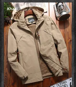 Detail of khaki outdoor jacket showing the adjustable hood and mountain logo on the chest