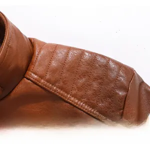 Detail shot of brown PU leather jacket featuring vertical stitched shoulder padding