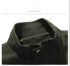 Detailed macro view of the ribbed knit stand collar on this olive military jacket