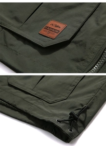 Close-up of the waterproof fabric texture, leather label and adjustable drawstring hem
