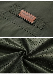 Detail of army green outdoor vest showing brand badge and breathable mesh lining texture
