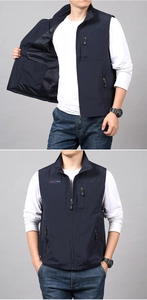 Detail view of navy quick-dry vest showing zipper pockets and breathable mesh lining