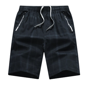 Men's cotton plaid shorts in navy blue with elastic waist and secure zipper pockets