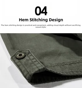 Detail of army green cotton shirt hem featuring double stitching and a retro metal button