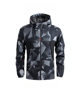 Front view of men's hooded windbreaker jacket with grey and black geometric camouflage pattern